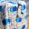 Close up of the hand knotted zip pull on the Tulip Cotton Quilted Wash Bag Close up of the hand knotted zip pull on the Tulip Cotton Quilted Wash Bag